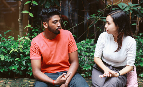 A couple having a serious discussion in a private outdoor setting