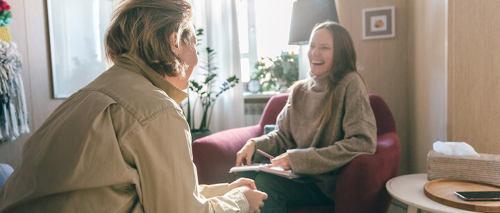 Two young women laughing